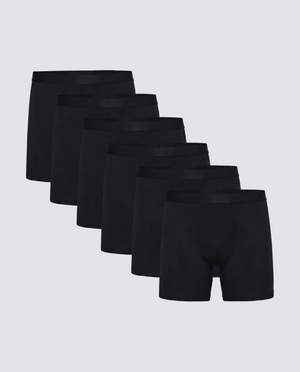 Set of six black boxer briefs on a light gray background