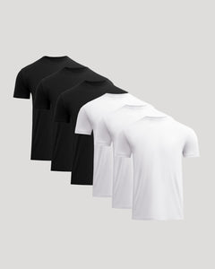 True ClassicSet of black and white polo shirts on a light gray background