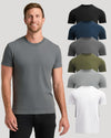 A smiling man wearing a plain short-sleeve crew-neck T-shirt in heather gray, with six additional color options stacked vertically on the right: black, navy, charcoal gray, olive green, light gray, and white. The background is a clean light gray studio backdrop.