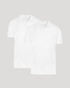 Two white polo shirts on a light gray background