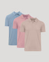 Three polo shirts in blue, pink, and beige on a light gray background