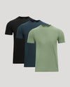 Three short-sleeve shirts in black, blue, and green on a light gray background