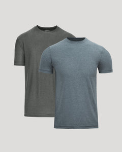 Two short-sleeve crew-neck t-shirts displayed on invisible mannequins against a light gray background. The front shirt is a heathered slate blue, and the shirt behind it is a heathered dark gray.
