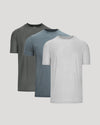 Three gray t-shirts in different shades on a light gray background