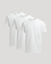 Three white t-shirts stacked on a light gray background