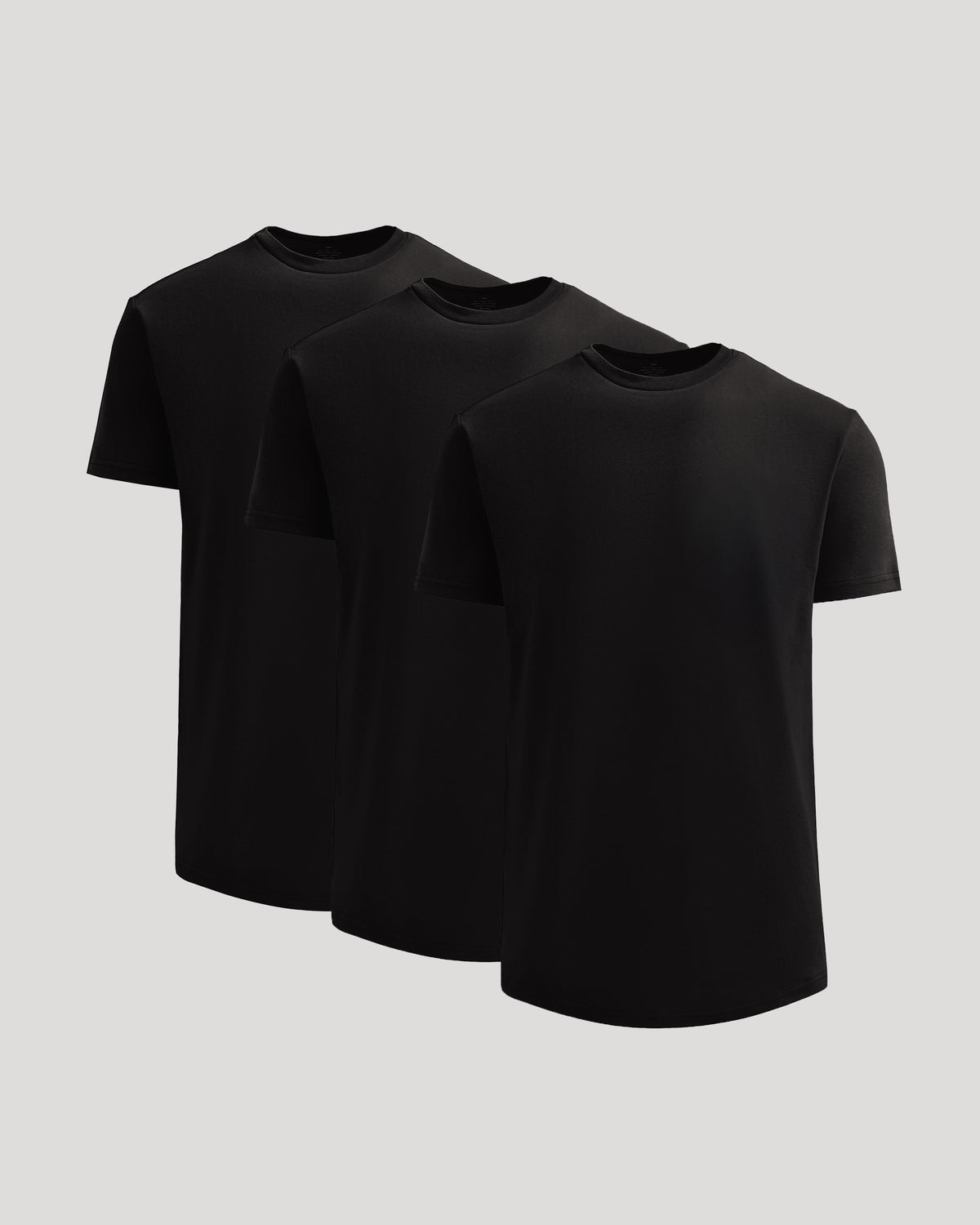 Three black crew neck t-shirts arranged side by side, showcasing the True Classic Men's Heavyweight Curved Hem Crew – Premium Heavyweight Cotton Blend, Modern Athletic Fit, Structured Everyday T-Shirt in men's basics style.