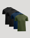 Four short-sleeve crew-neck t-shirts in black, dark gray, navy blue, and olive green, arranged in a staggered diagonal row on a light gray background.