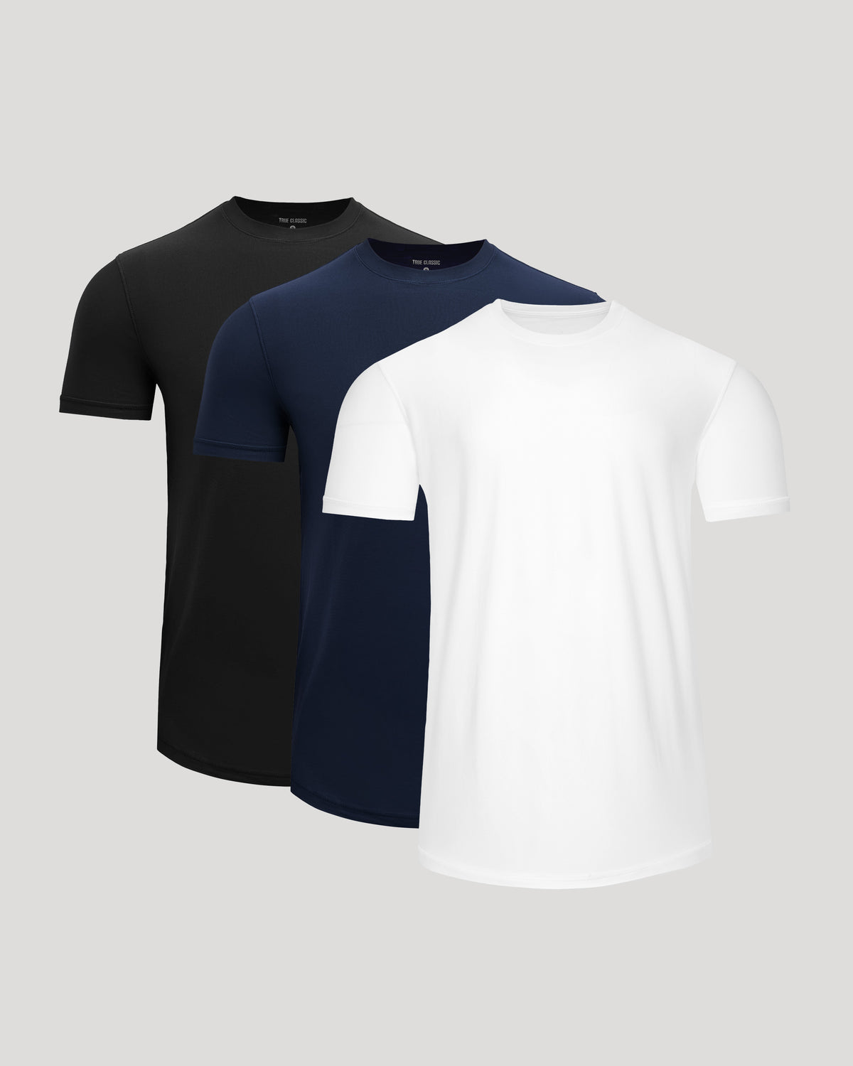 Three-pack of Active Curved Hem Crew Tee - Men's Moisture Wicking Performance T-Shirt in black, navy, and white, showcasing a clean, fitted design ideal for men's basics and active wear.