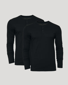 True ClassicTwo black long-sleeve henley shirts on a light gray background