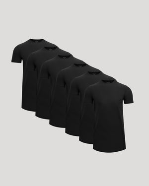 Stack of black t-shirts on a light gray background