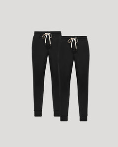 True ClassicTwo black jogger pants with white drawstrings on a light gray background
