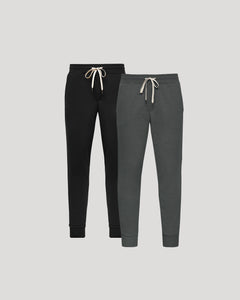 True ClassicNavy and gray sweatpants with drawstrings on a light gray background