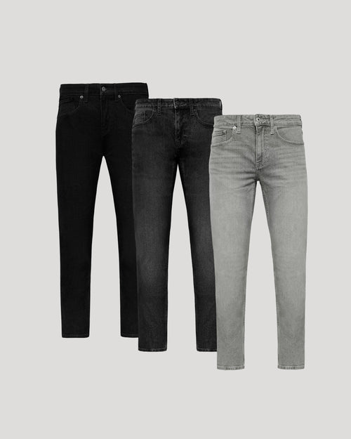 Three pairs of jeans in black, dark gray, and light gray on a light gray background