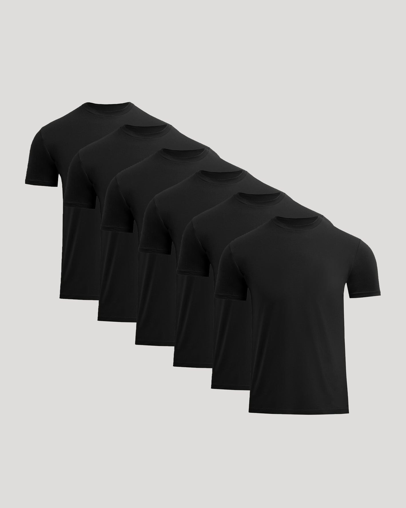 Set of six black t-shirts on a light gray background
