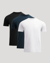 Three plain t-shirts in black, navy, and white on a light gray background