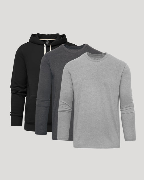 Three long-sleeve shirts in black, gray, and light gray on a light gray background
