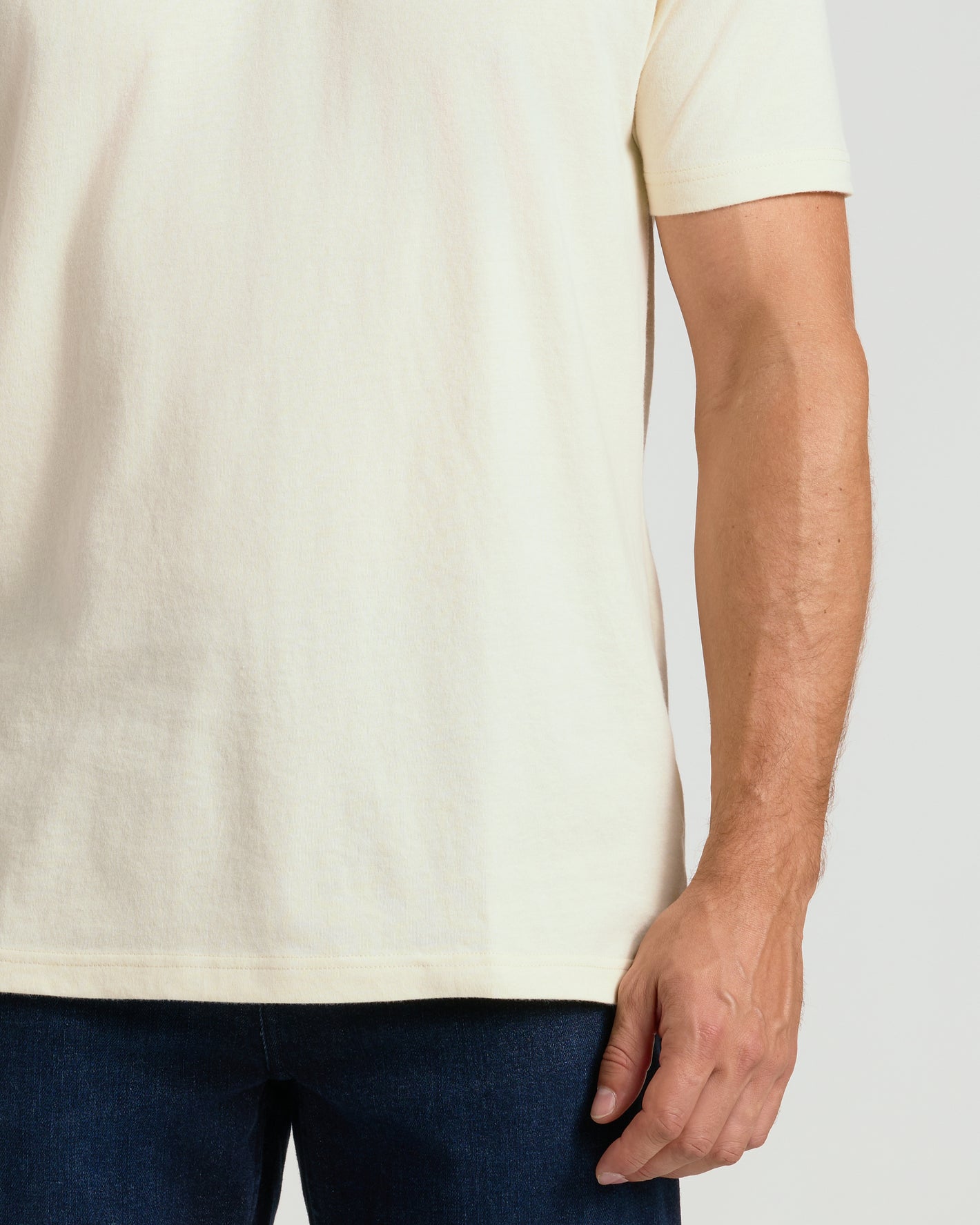 Alabaster Classic Crew Neck T-shirt with dark blue jeans.