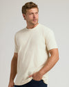 Man wearing Alabaster Classic Crew Neck T-shirt, showing casual style.