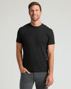 Black crew neck short sleeve t-shirt on model, slim fit.