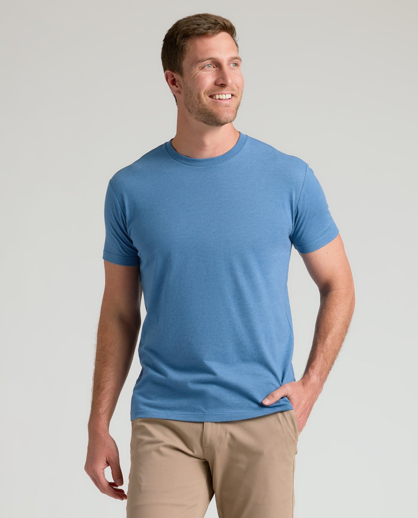 Man wearing Classic Crew Neck 3-Pack, blue T-shirt, khaki pants.