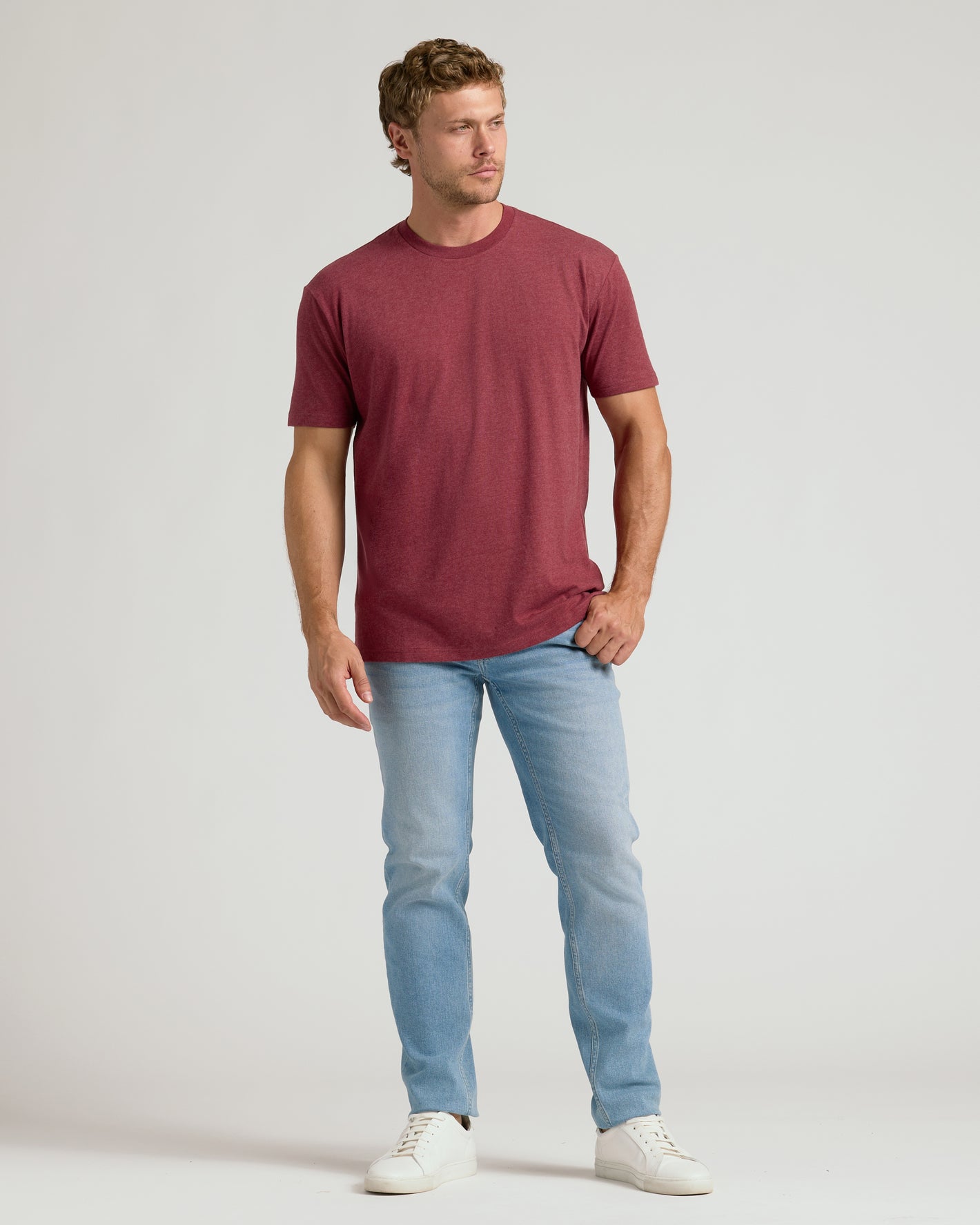 Man wearing Dark Heather Claret Classic Crew Neck t-shirt.