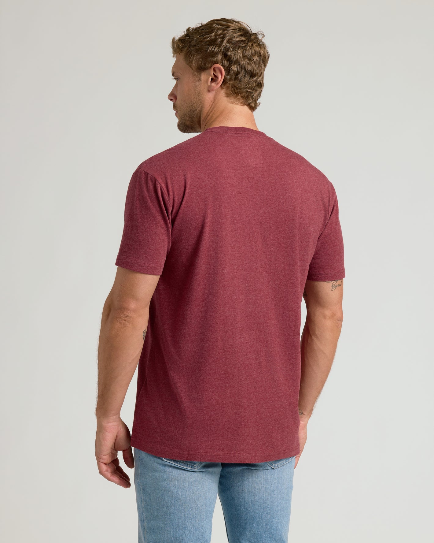 Man wearing Dark Heather Claret Classic Crew Neck, showcasing T-shirt fit.