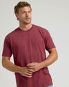 Dark Heather Claret Classic Crew Neck on young man, neutral backdrop.