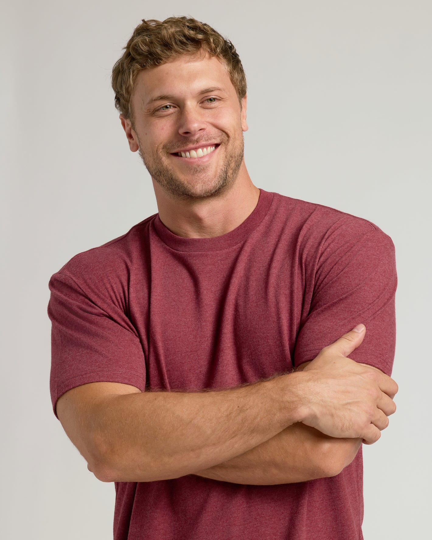Man in maroon CombinedListingTest Classic Crew Neck, smiling.