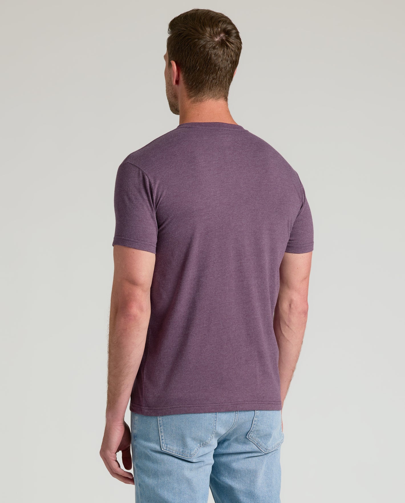 Back view of Dark Heather Plum Classic Crew Neck on male model.