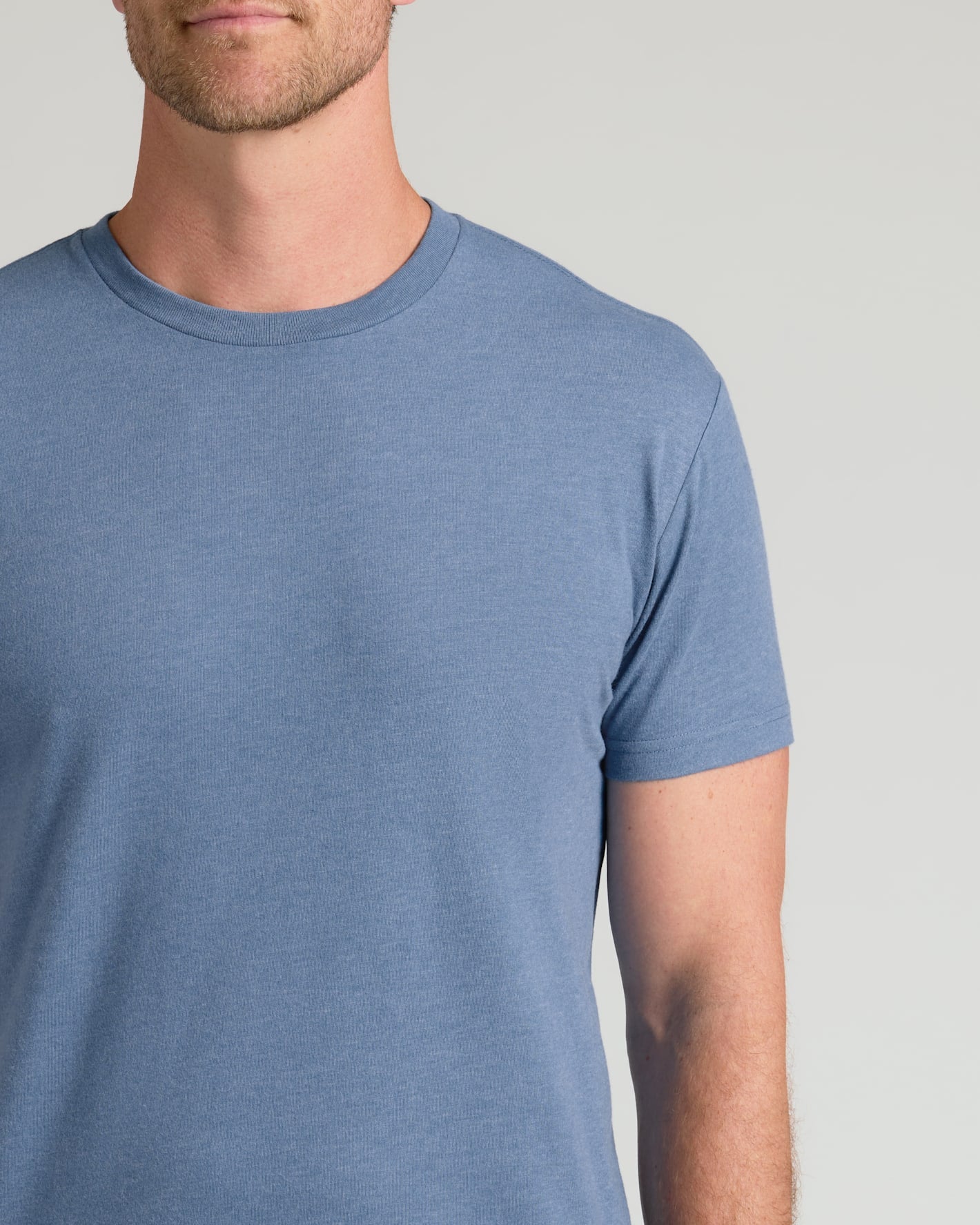 Man wearing Dark Heather Vintage Navy Classic Crew Neck T-shirt.