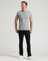 Man wearing Classic Crew 3-Pack: heather gray tee, black pants, white sneakers.