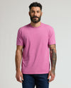 Man wearing Heather Magenta Classic Crew Neck with tattoos visible on forearm.