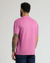 Back view of man in Heather Magenta Classic Crew Neck.