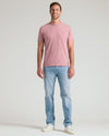 Man wearing Light Heather Boysenberry Classic Crew Neck with jeans and sneakers.