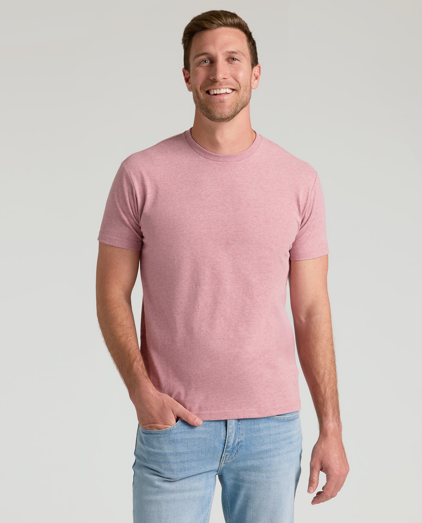 Man in Light Heather Boysenberry Classic Crew Neck T-shirt, smiling.
