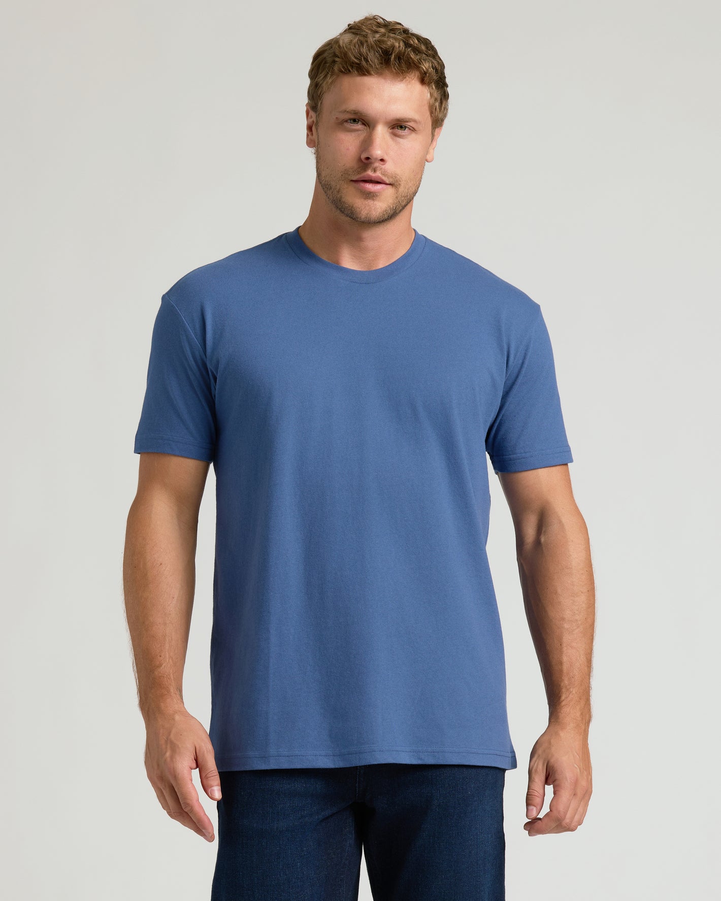 Man wearing Classic Crew 3-Pack blue t-shirt and dark jeans.