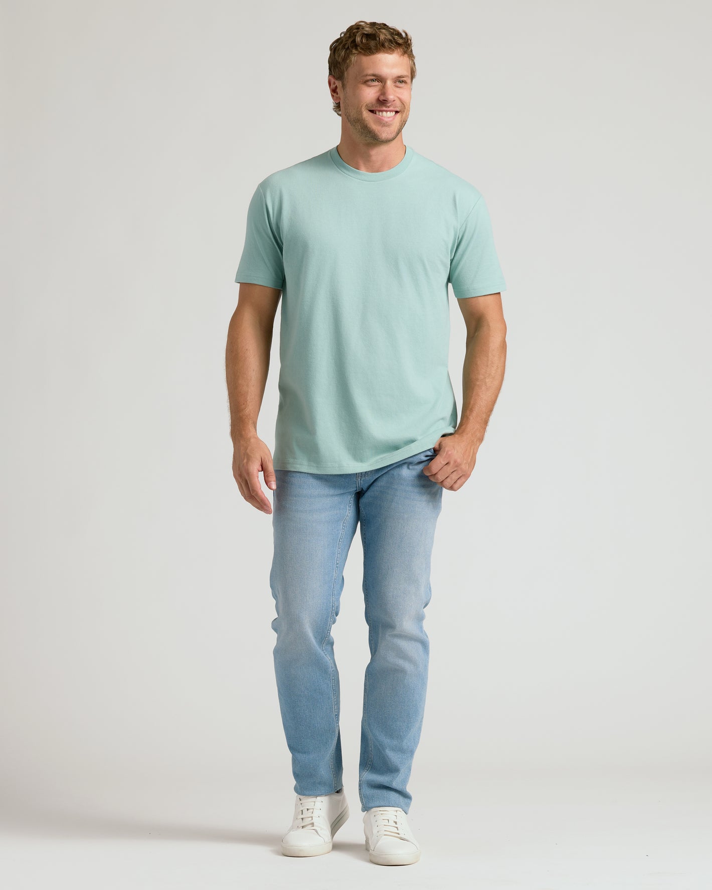 Man wearing CombinedListingTest Classic Crew Neck T-shirt, smiling.