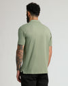 Back view of man in Dark Heather Bay Green Classic Polo.