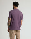 Back view of man in Dark Heather Plum Classic Polo.