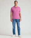 Man wearing Heather Magenta Classic Polo with jeans and sneakers.