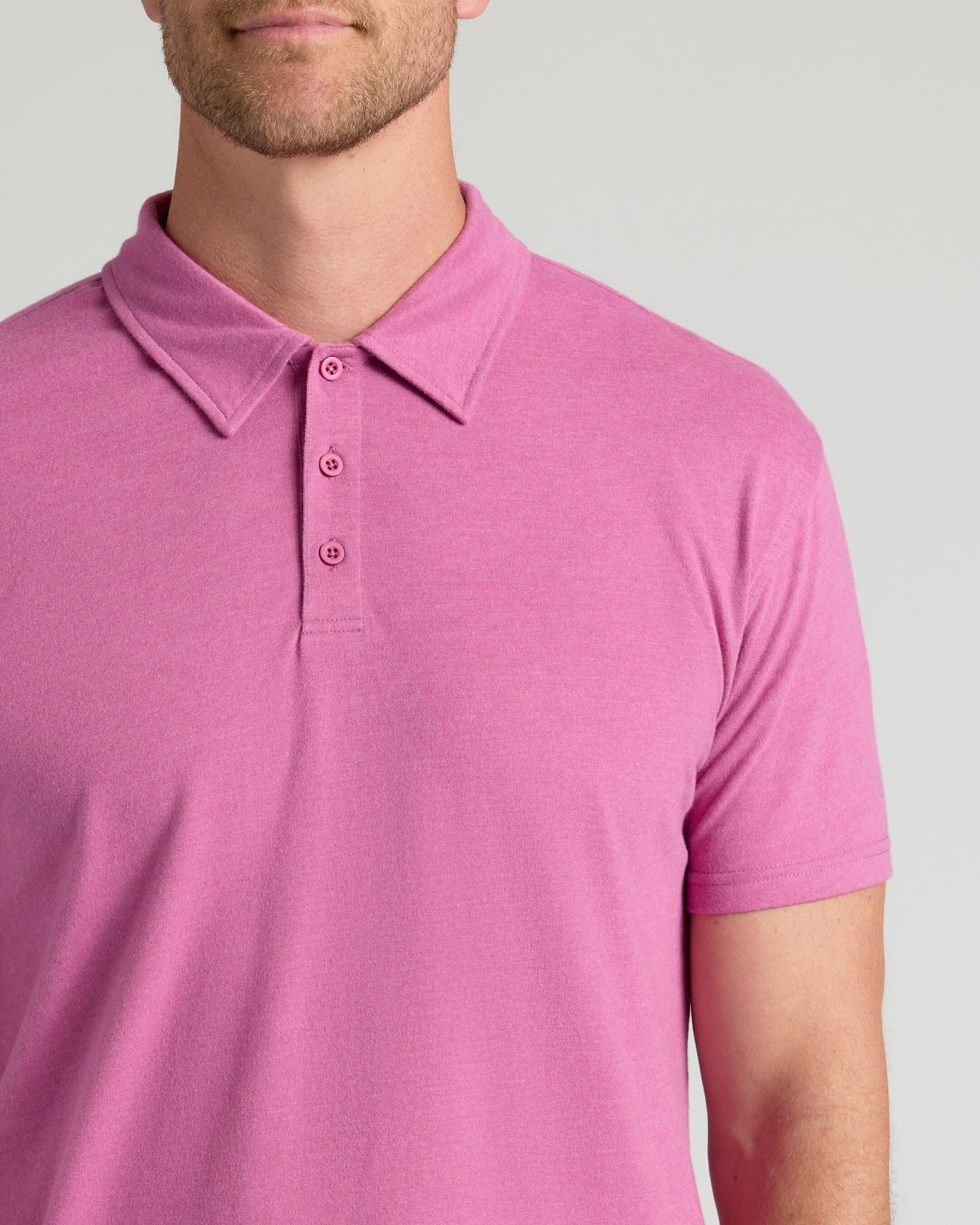 Heather Magenta Classic Polo with short sleeves and three-button placket.