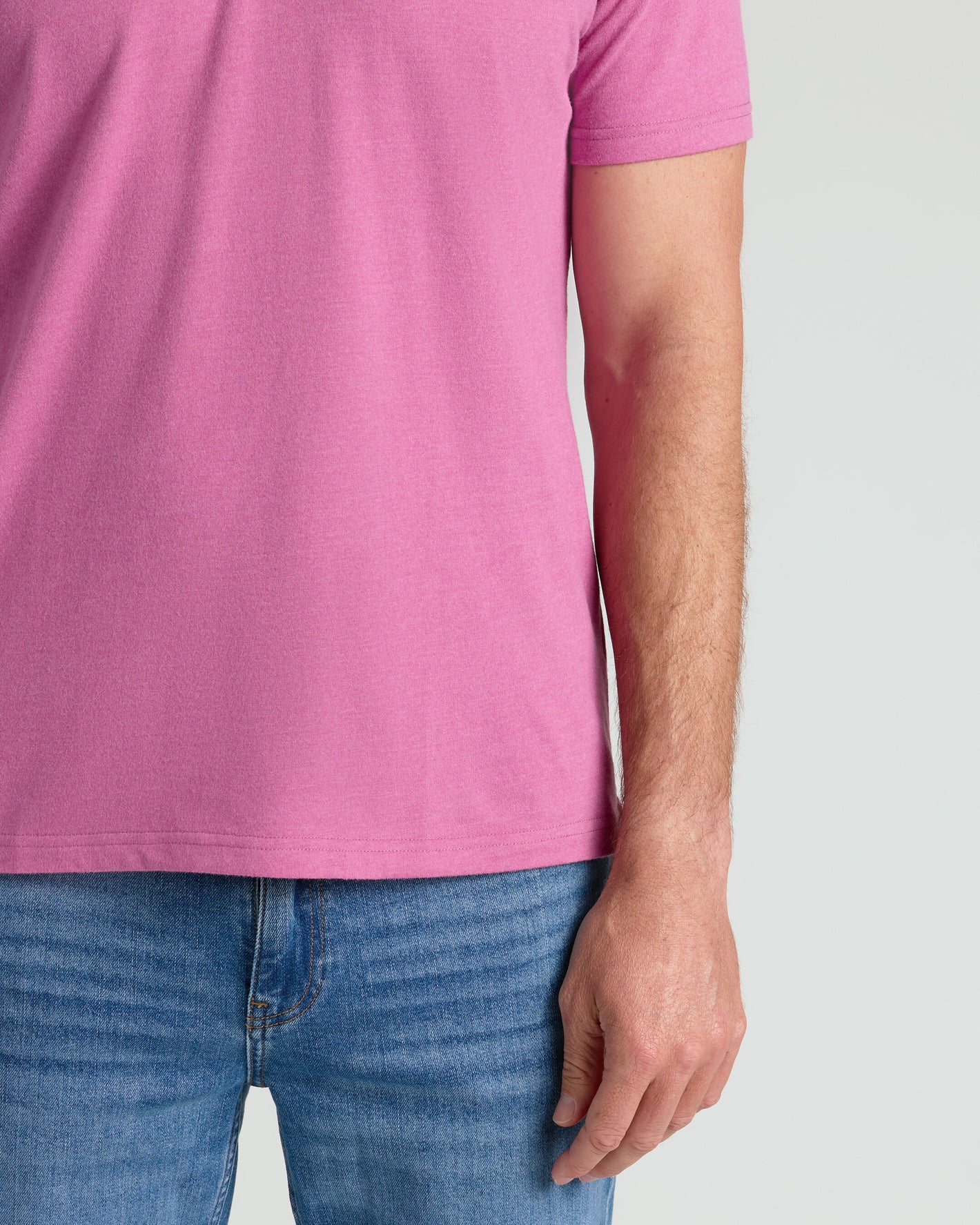 Heather Magenta Classic Polo worn with blue jeans.