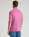 Back view of Heather Magenta Classic Polo worn with blue jeans.