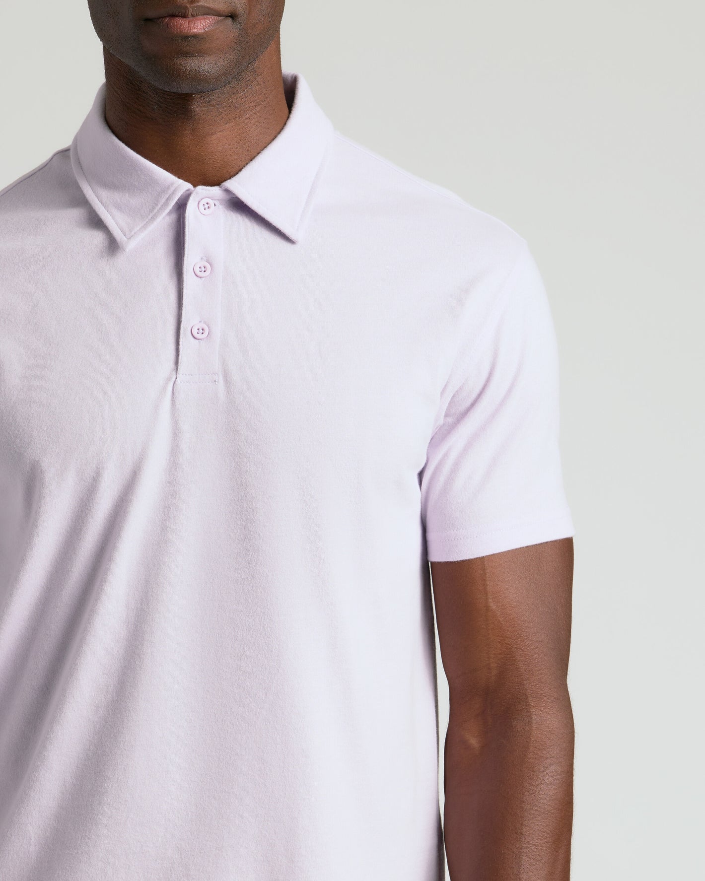 Heather Orchid Classic Polo showcasing a three-button placket and short sleeve.