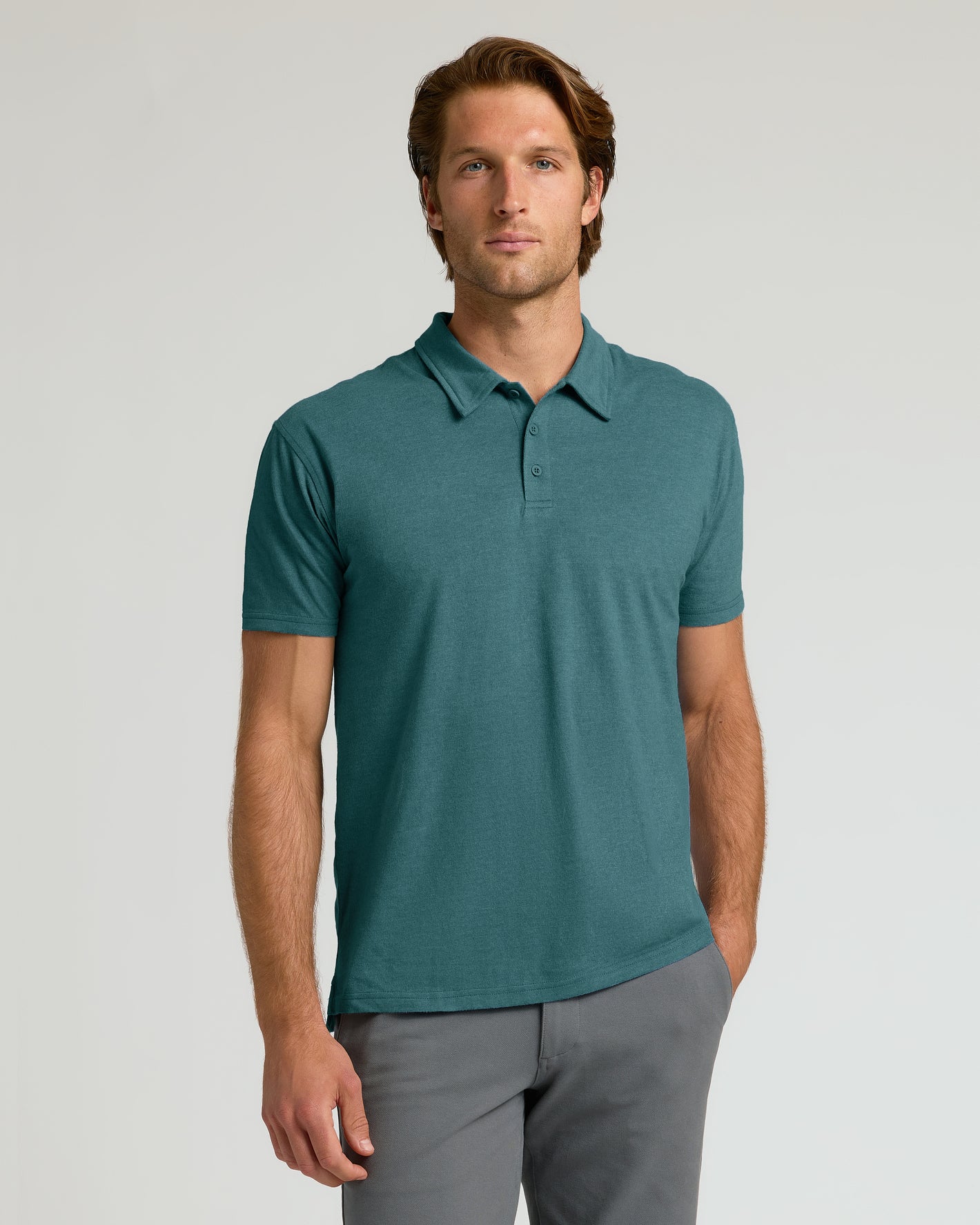 Heather Seafarer Classic Polo worn by model against grey background.