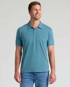 True ClassicModel wearing Glacial Short Sleeve Polo, teal-blue, with medium-wash jeans.
