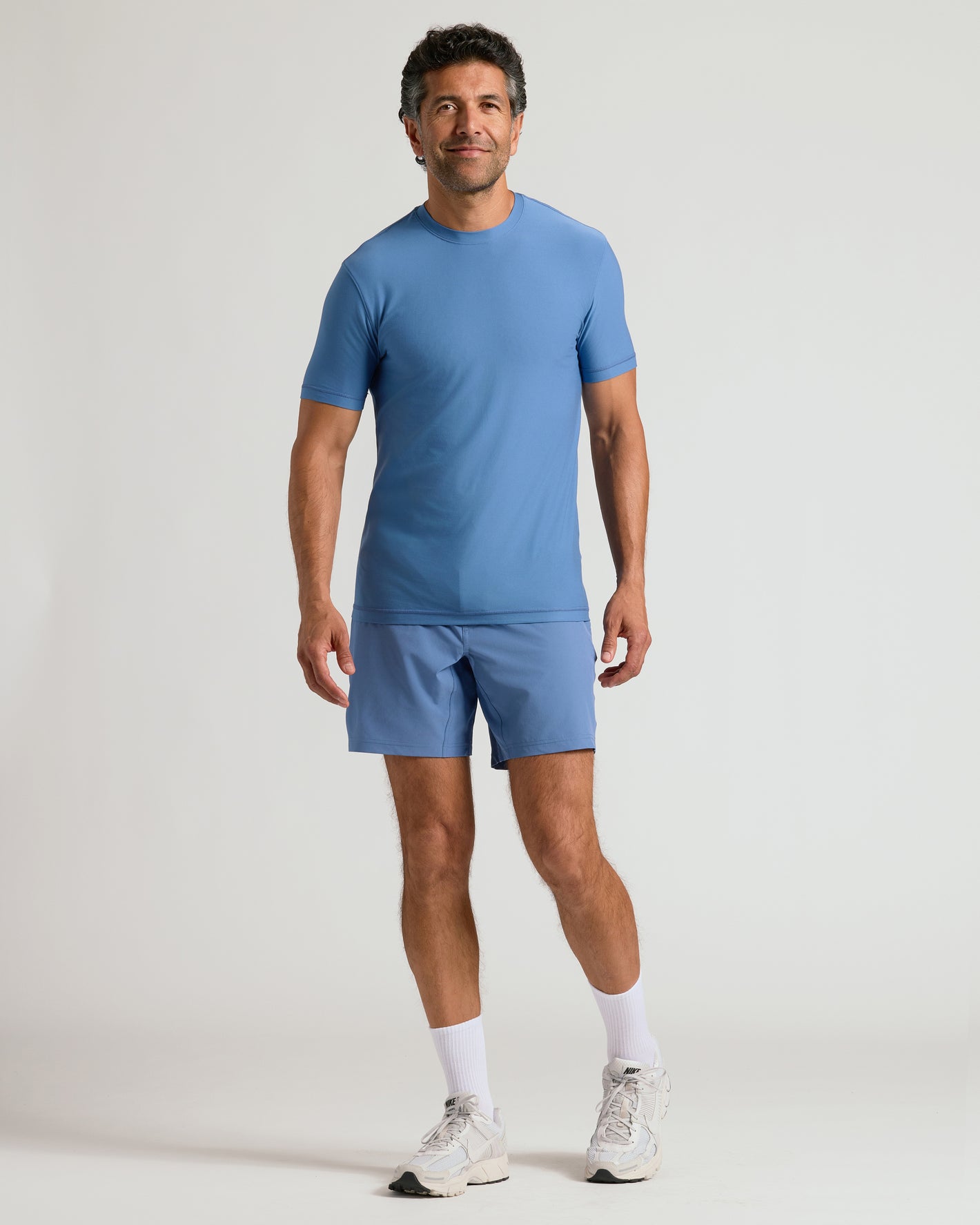 Man wearing Azul Active Crew Neck Tee and matching shorts, showcasing athletic wear.