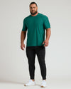 Clover Active Crew Neck Tee on athletic man, relaxed pose.