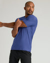 Man stretching in Cosmos Active Crew Neck Tee.