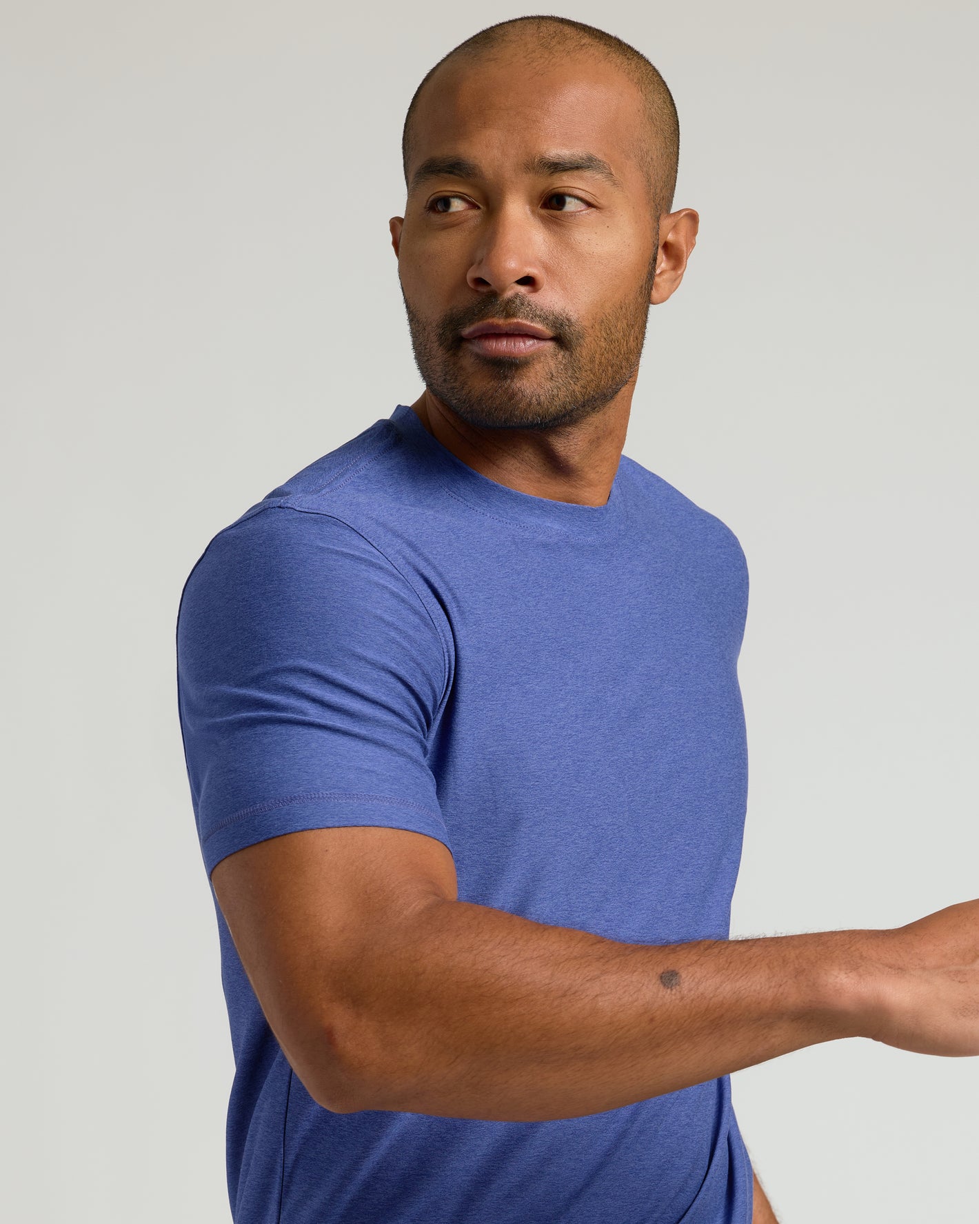 Cosmos Active Crew Neck Tee on man with stubble.